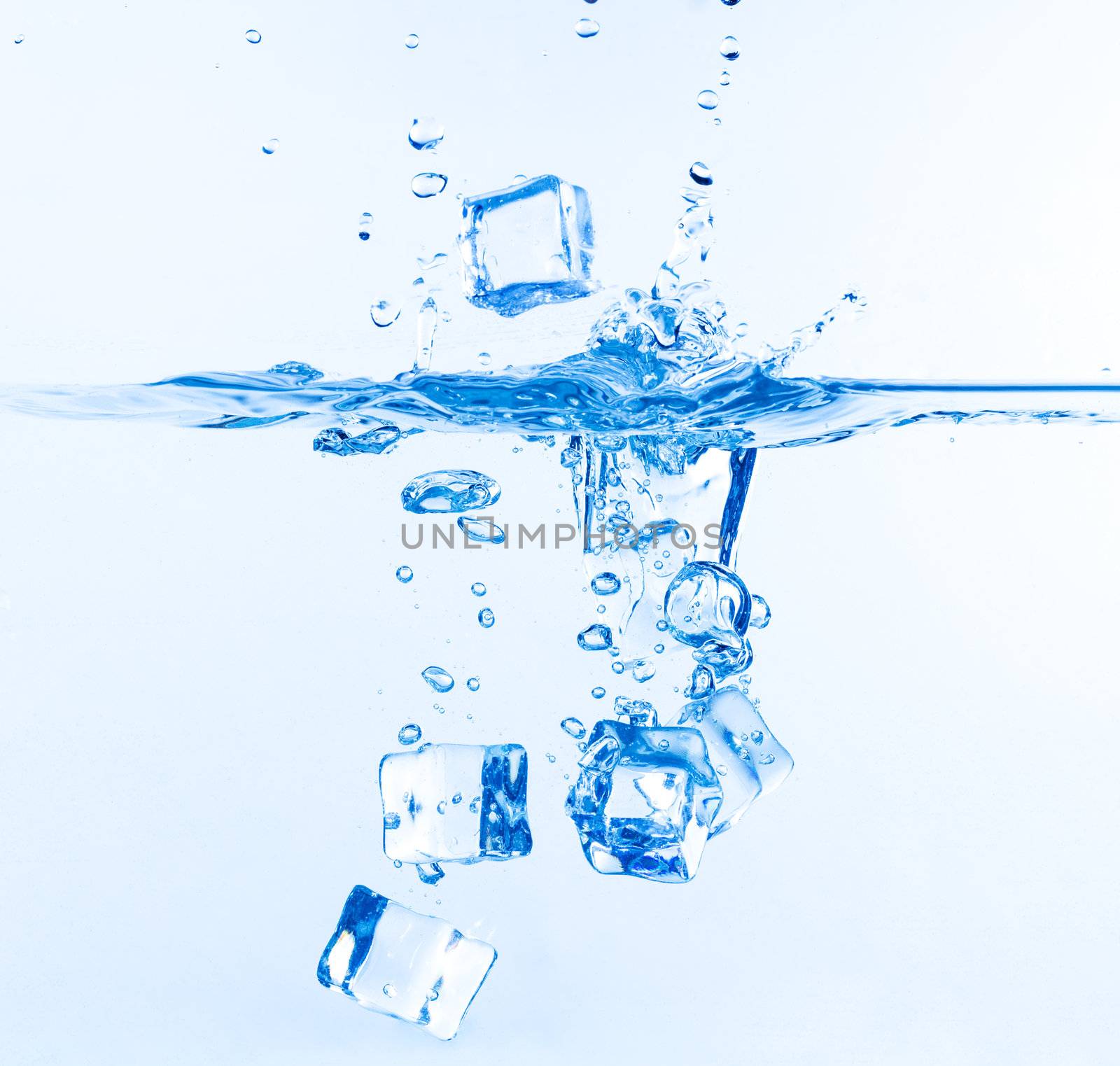 Ice Cubes Dropped into Water with Splash on white