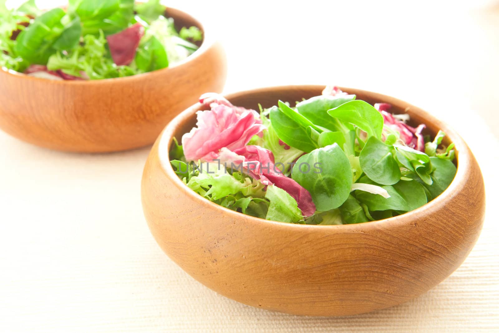 Two bowls of fresh salad