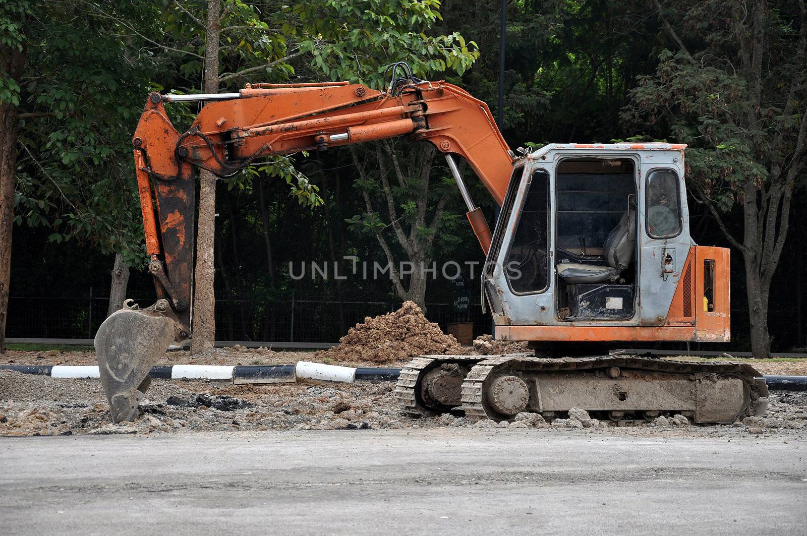 Excavators are heavy construction equipment consisting of a boom, bucket and cab on a rotating platform.