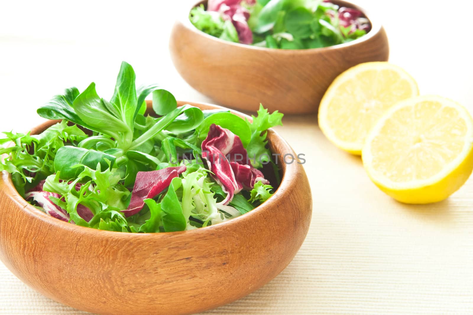 Two bowls of fresh salad