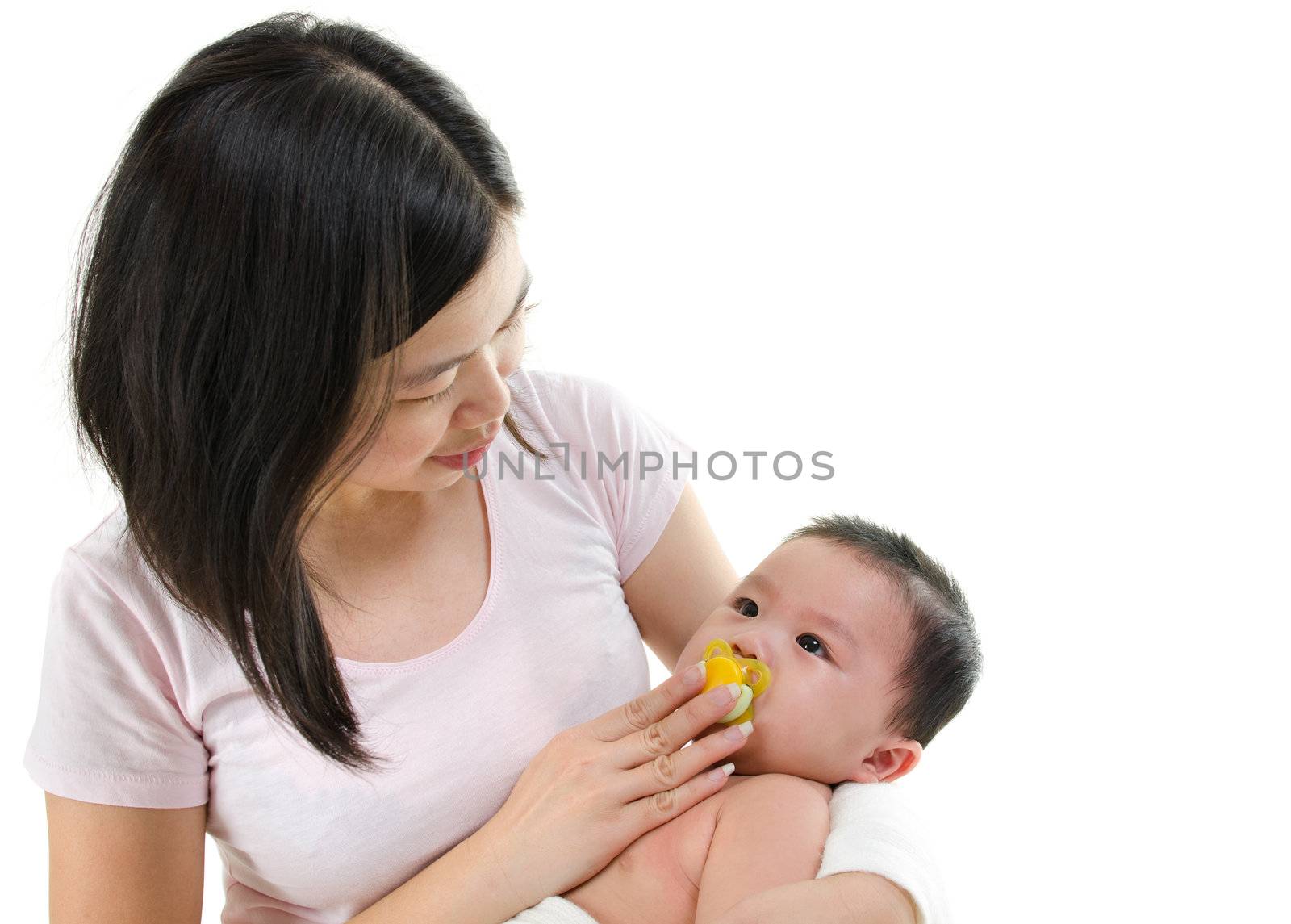 Asian mother trying to calm her crying baby boy isolated on white background