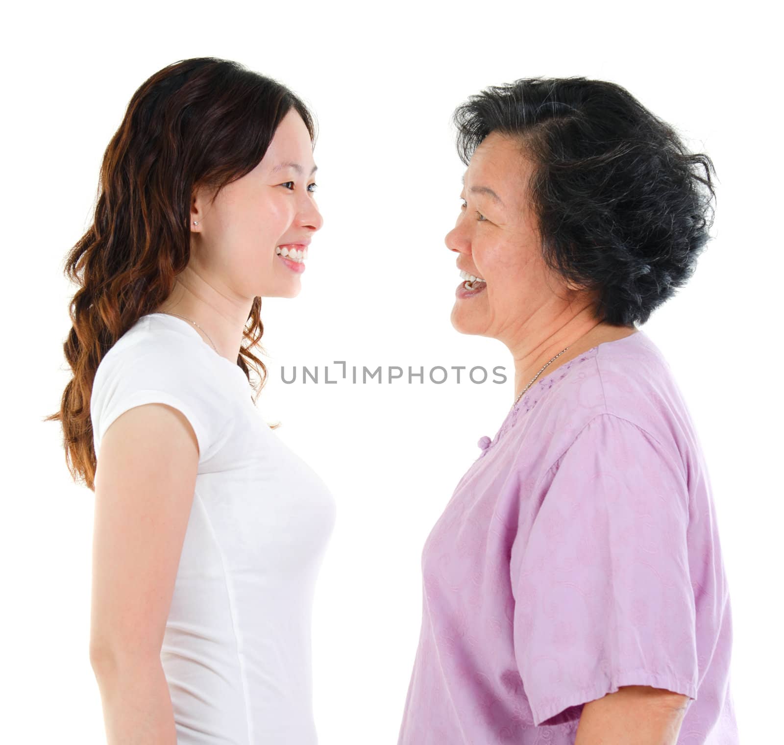 Ageing concept. Asian senior mother and adult daughter face to face, profile side view smiling isolated on white background.