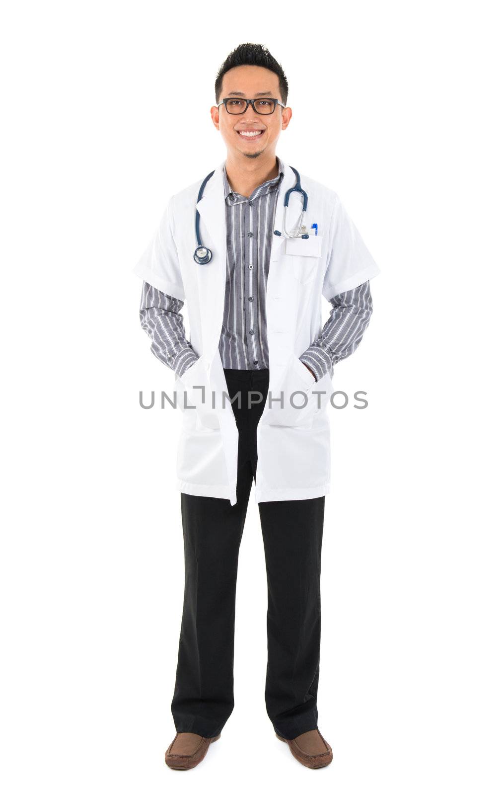 Full body southeast Asian medical doctor. Male medical doctor standing on white background with confident smile.