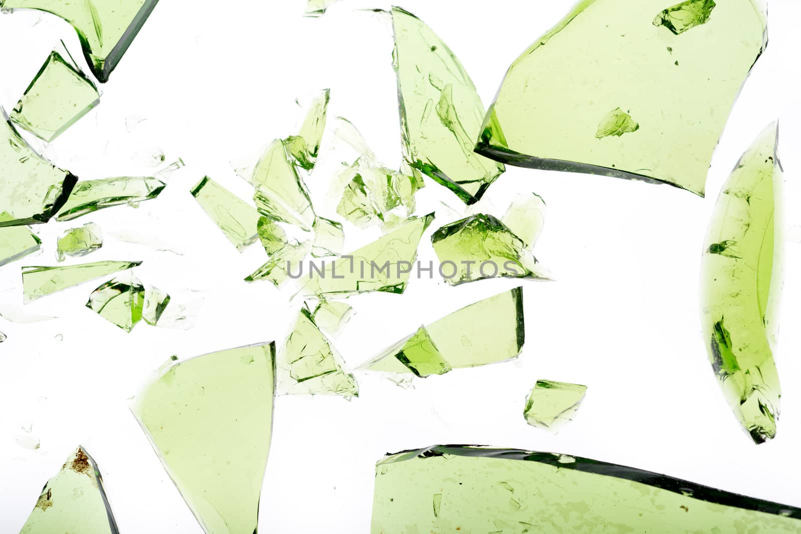 Green shattered bottle pieces isolated on white