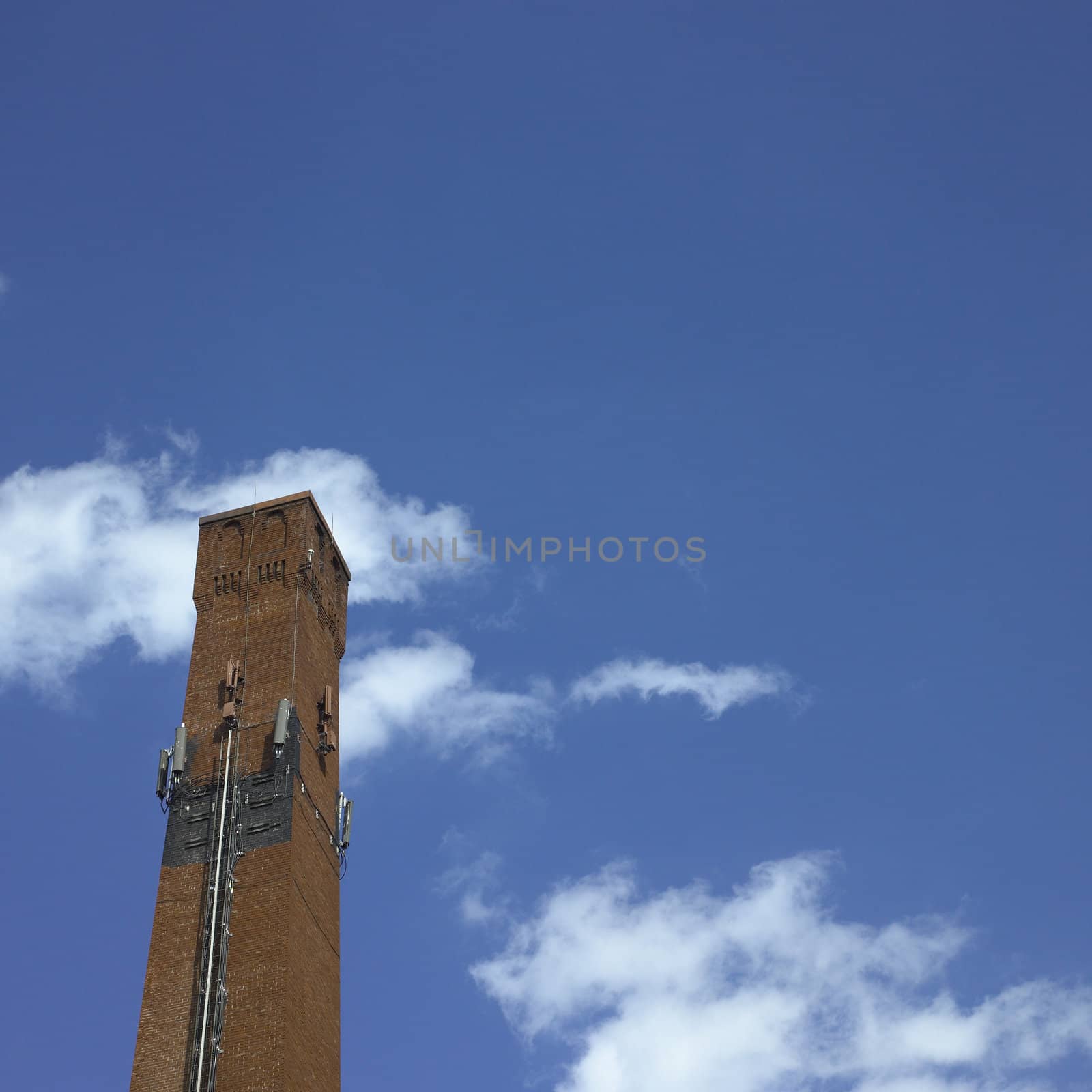 Brick industrial chimney and blue sky