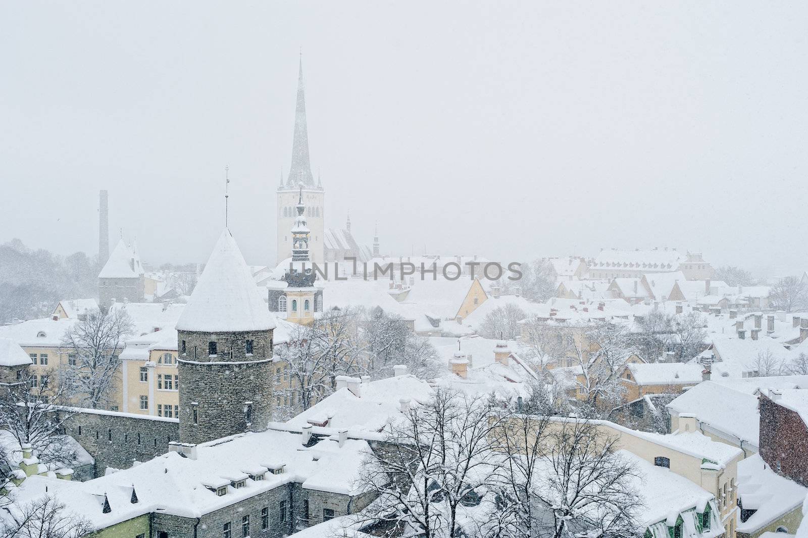 Roofs and towers in the city center in winter