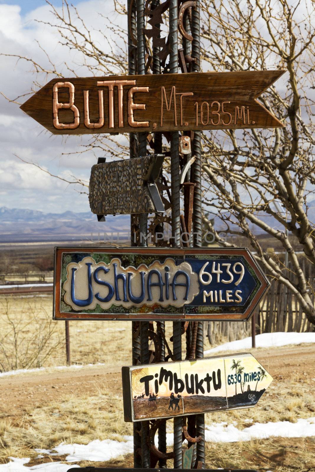 Directional signs point to distant places; location is Dragoon Mountains in Arizona; 