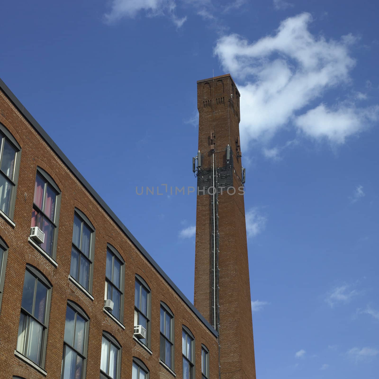 Brick industrial chimney and blue sky