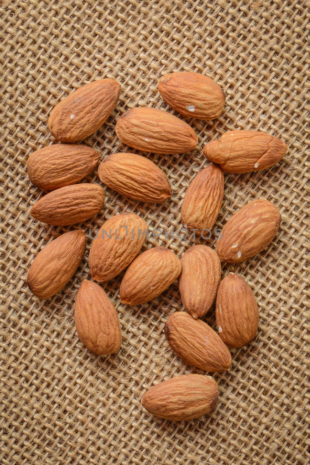 Almonds on Burlap Background