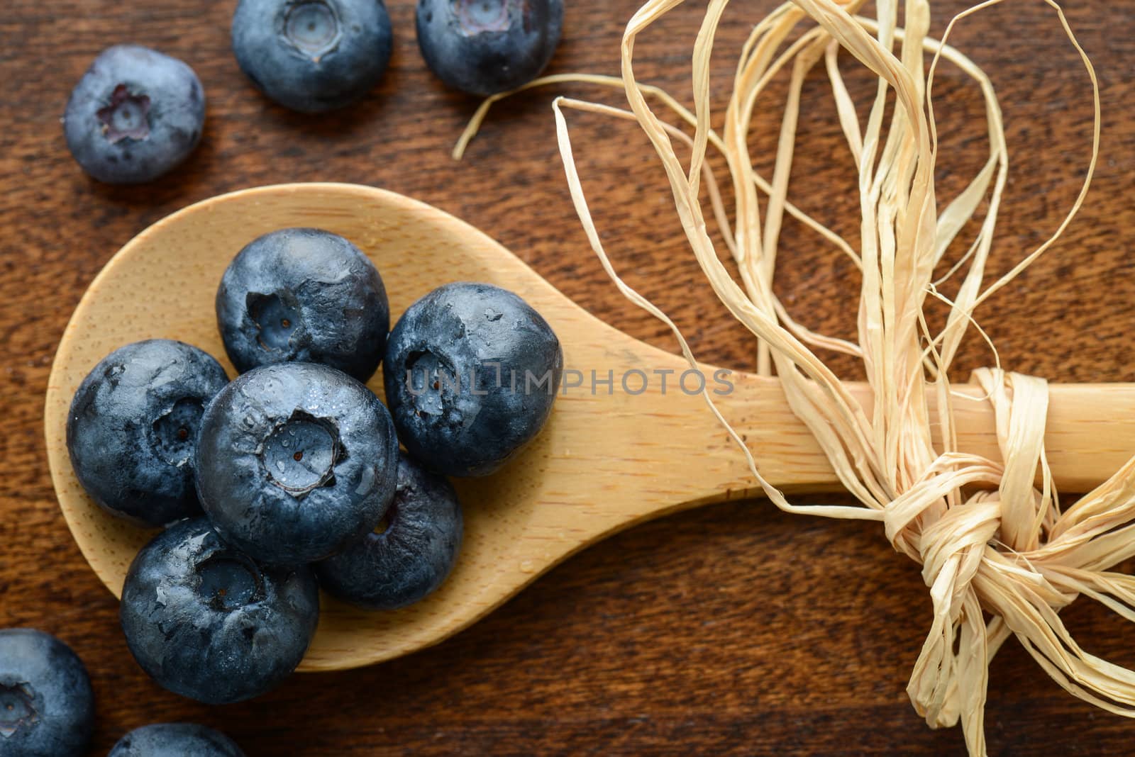 Blueberries on a Wooden Spoon by bbourdages