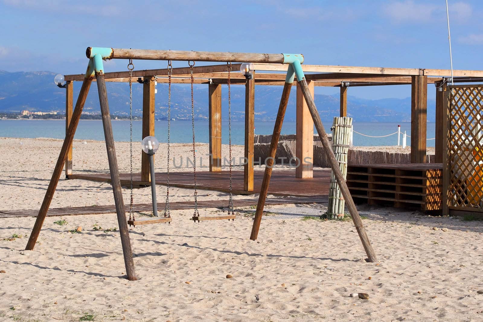 wood swings on the beach