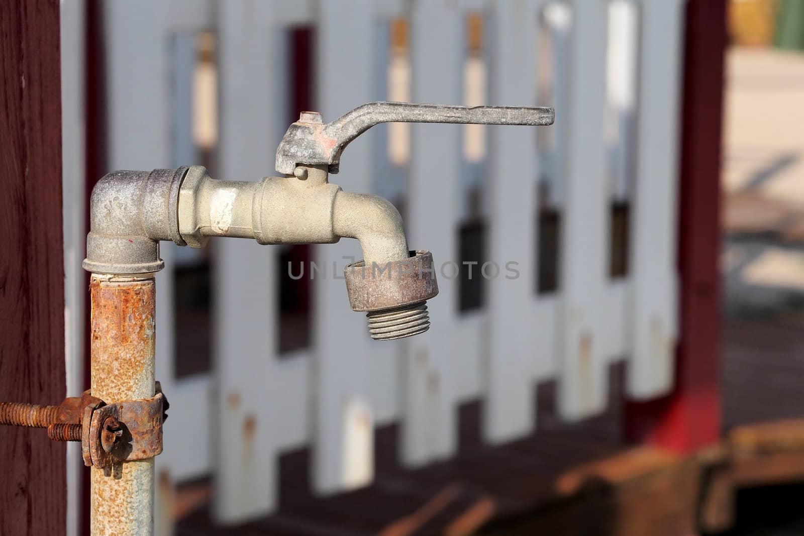 old and rusted faucet of iron