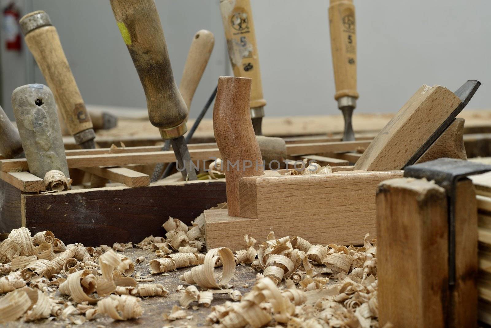 A wooden desk of a carpenter with some tools