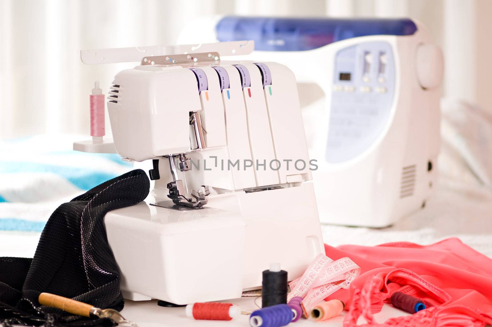 overlock and sewing machine is on the table