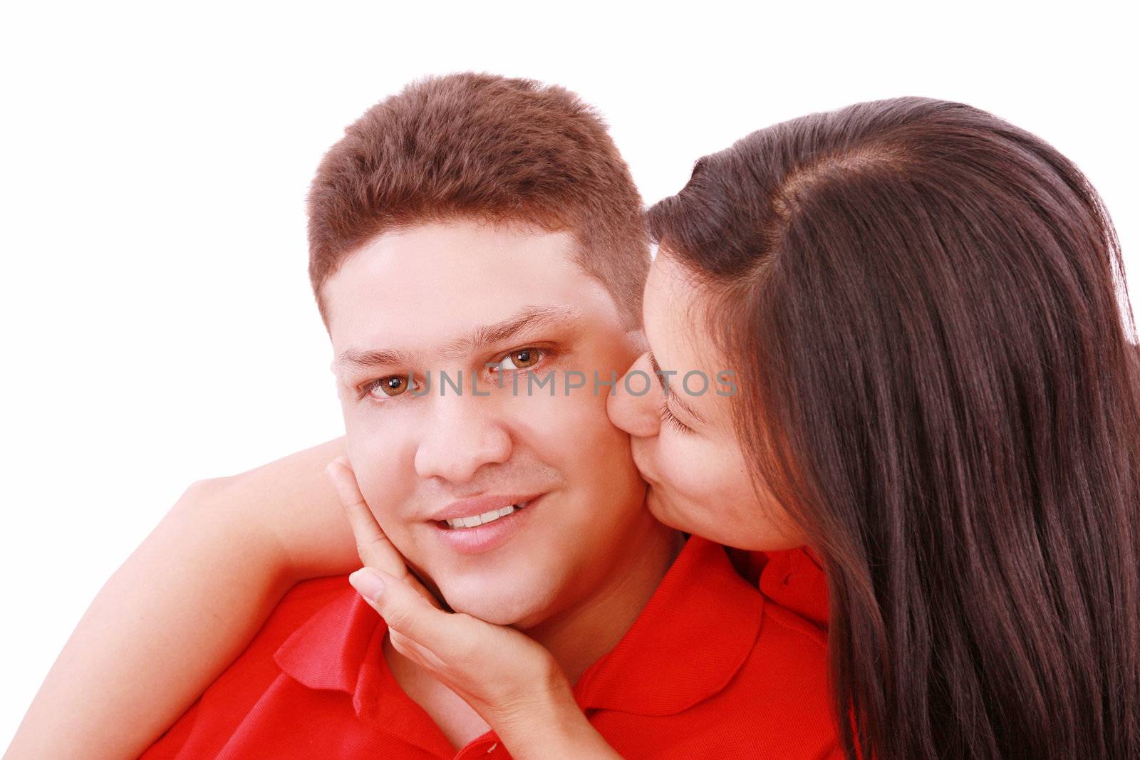 Young woman kissing her boyfriend by dacasdo