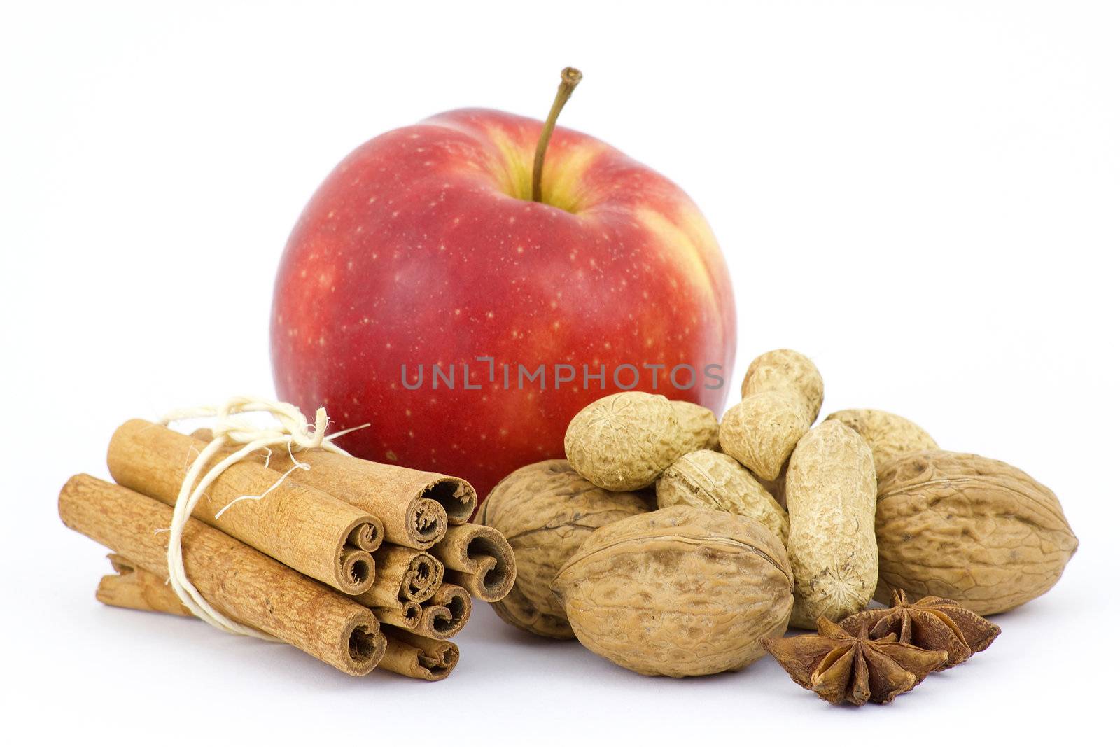 apple, cinnamon sticks and nuts