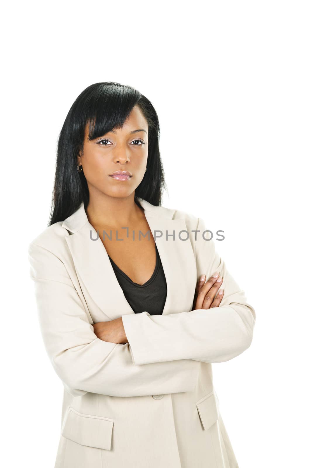 Serious black businesswoman with arms crossed by elenathewise