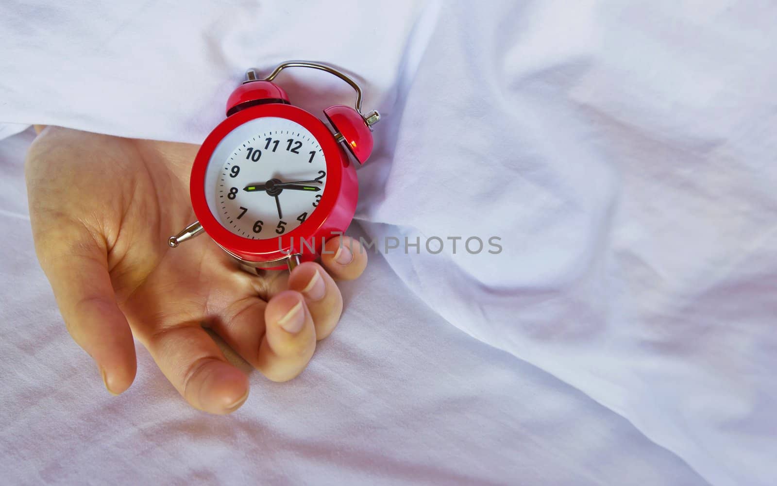 Alarm clock on hand by Myimagine