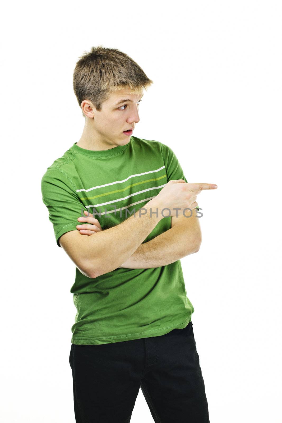Handsome young man giving directions pointing finger to the side