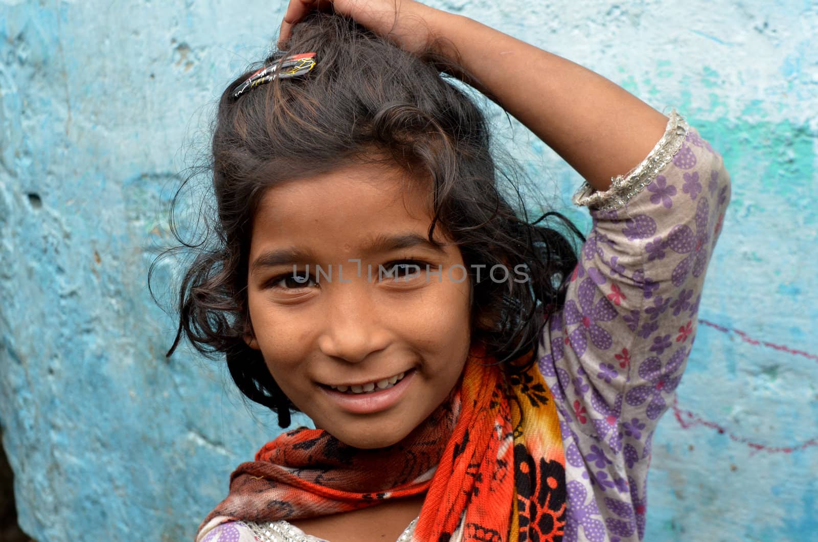 New Delhi,India-February 4, 2013:An unidentified child lives in the slums of New Delhi. 50% of the population of New Delhi is thought to live in slums,on February 4,2013 in New Delhi