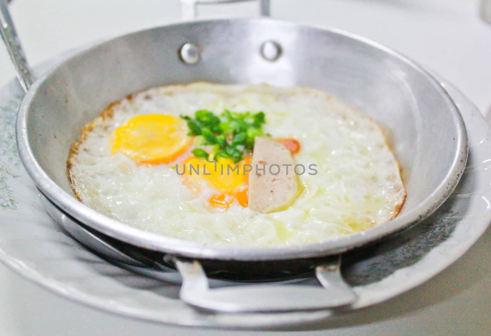 fried egg stuff with hot pan was served in the morning