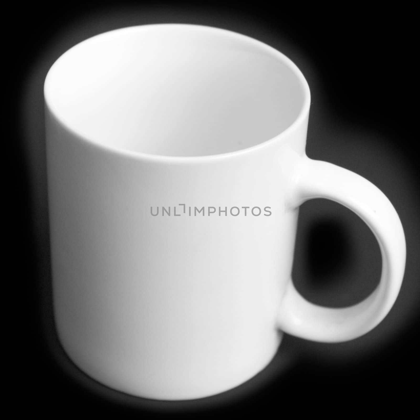 A blank empty white ceramic coffee mug