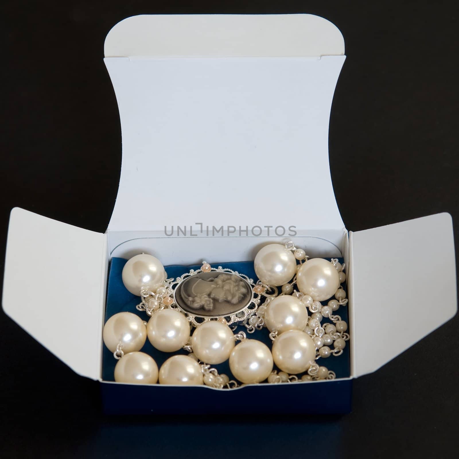 Beautiful necklace in a box on a black background