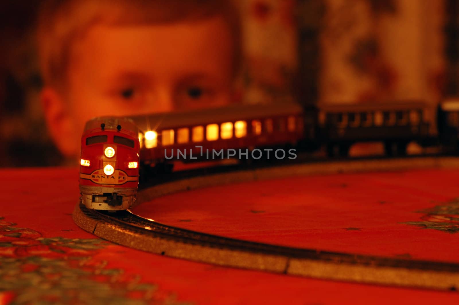 Norwegian christmas.
Boy have fun with an electrical model train. 
It`s only at christmas this train is up.