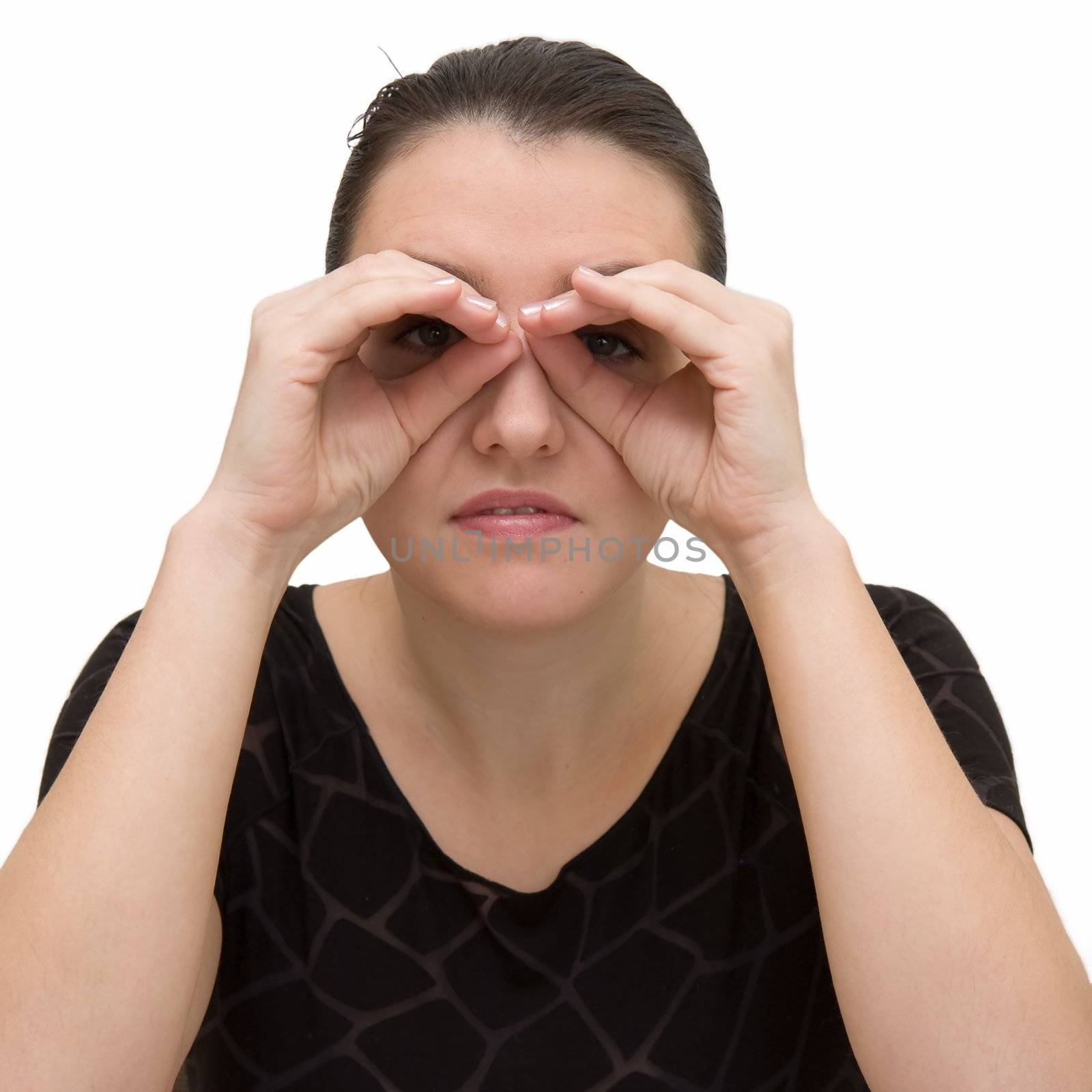 Searching. Serious woman with binoculars on a white background.
