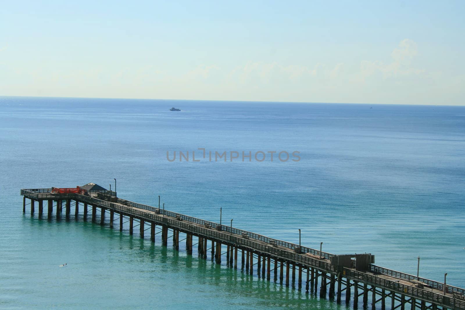 Big long pier on a sunny day.
