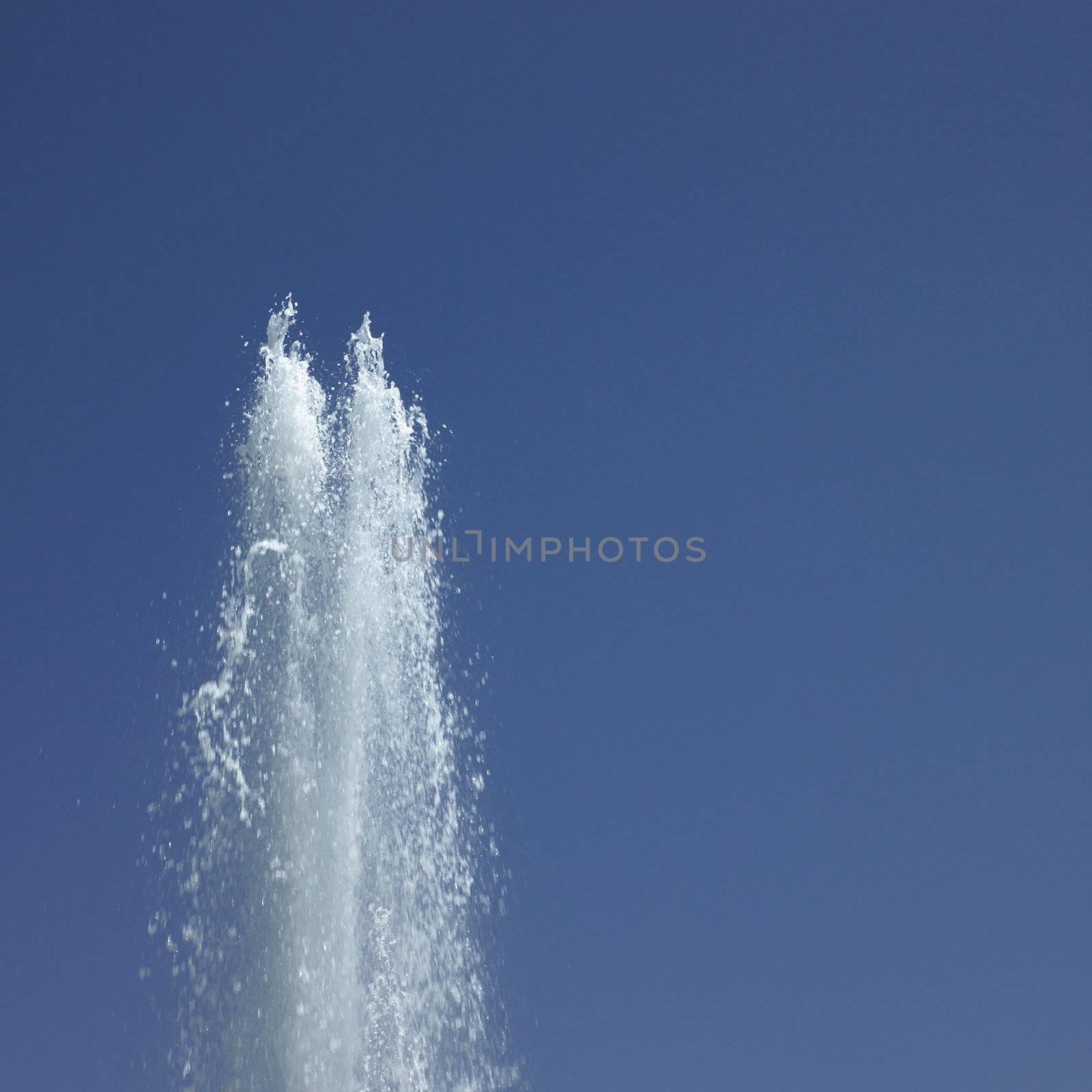 Fountain in the blue sky