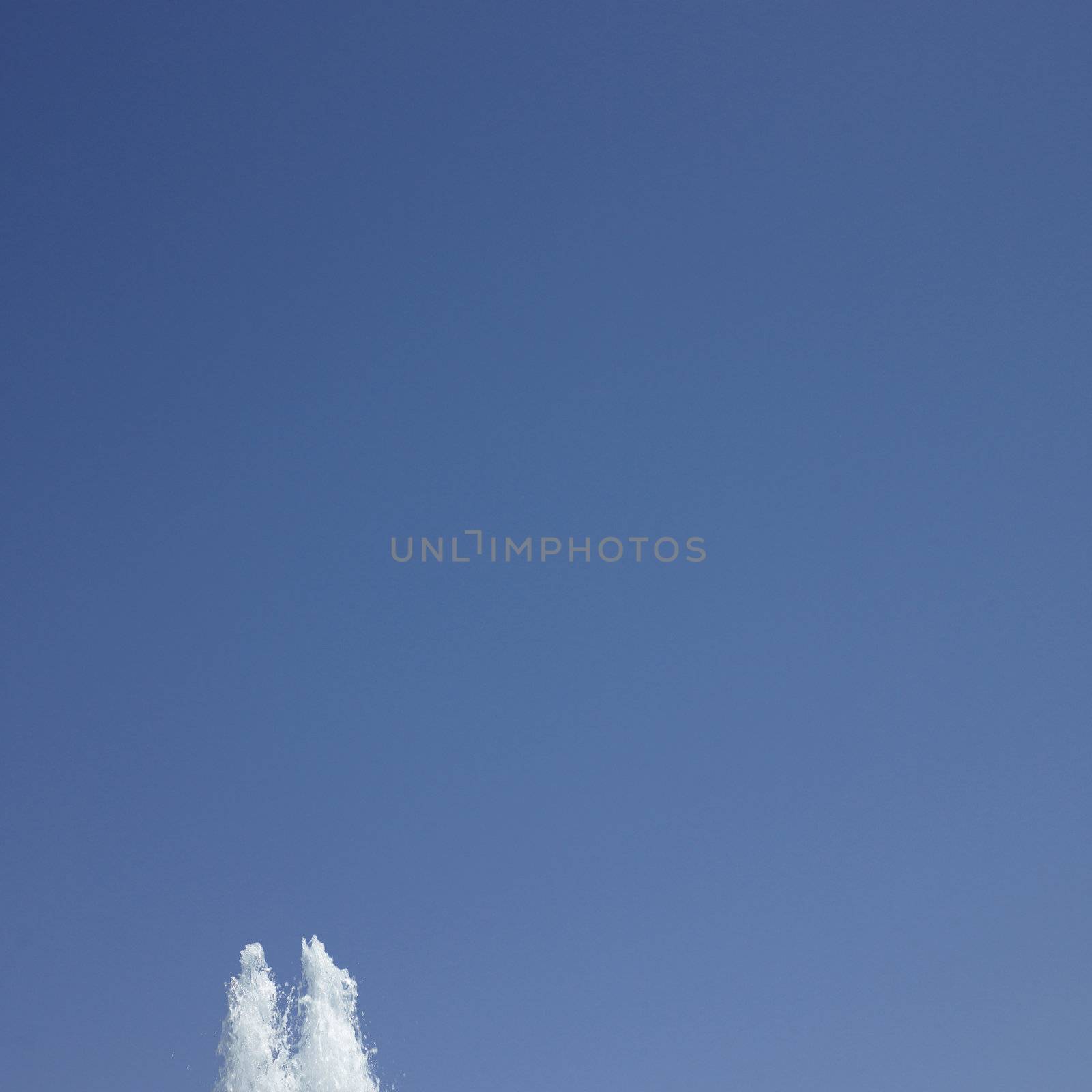 Fountain in the blue sky