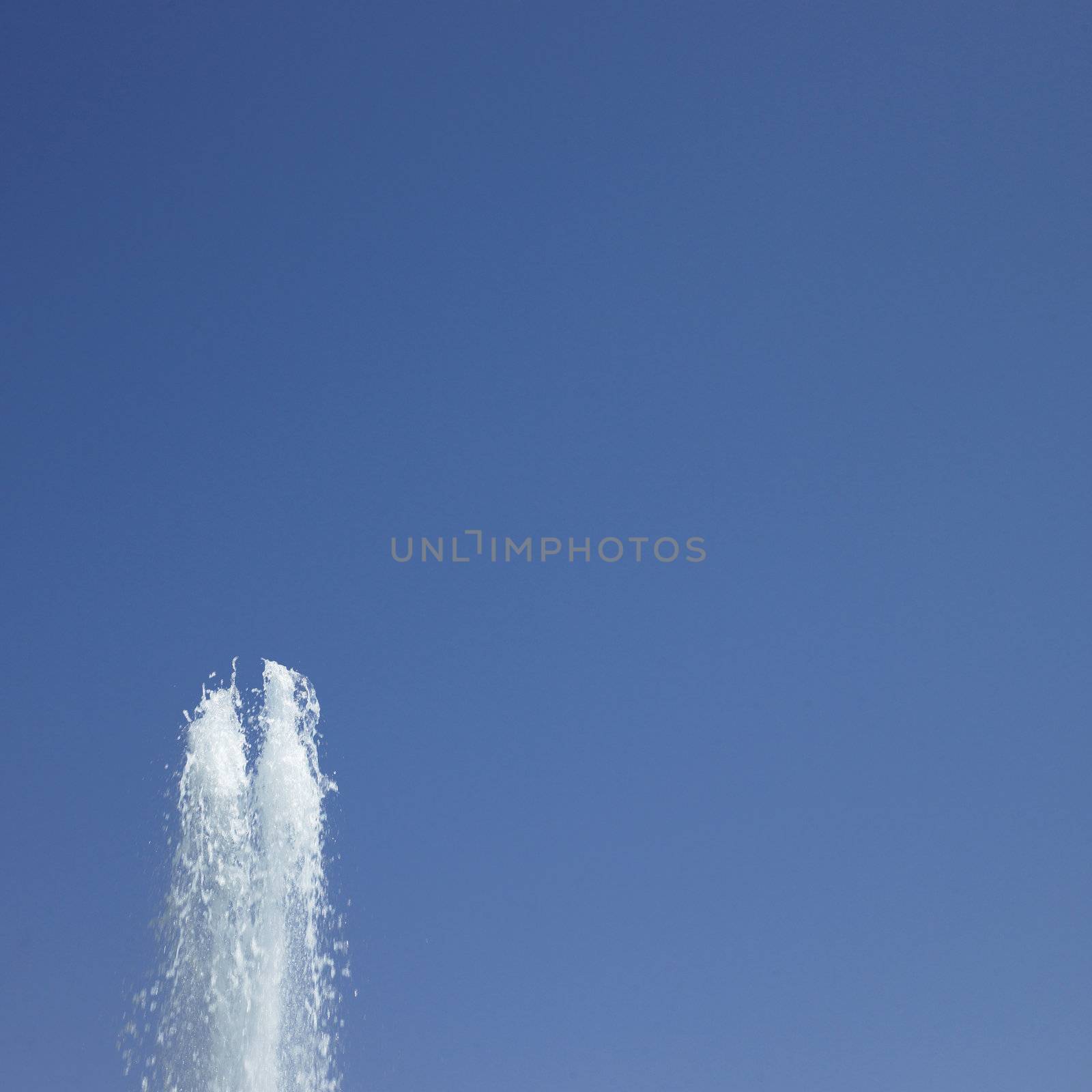 Fountain in the blue sky