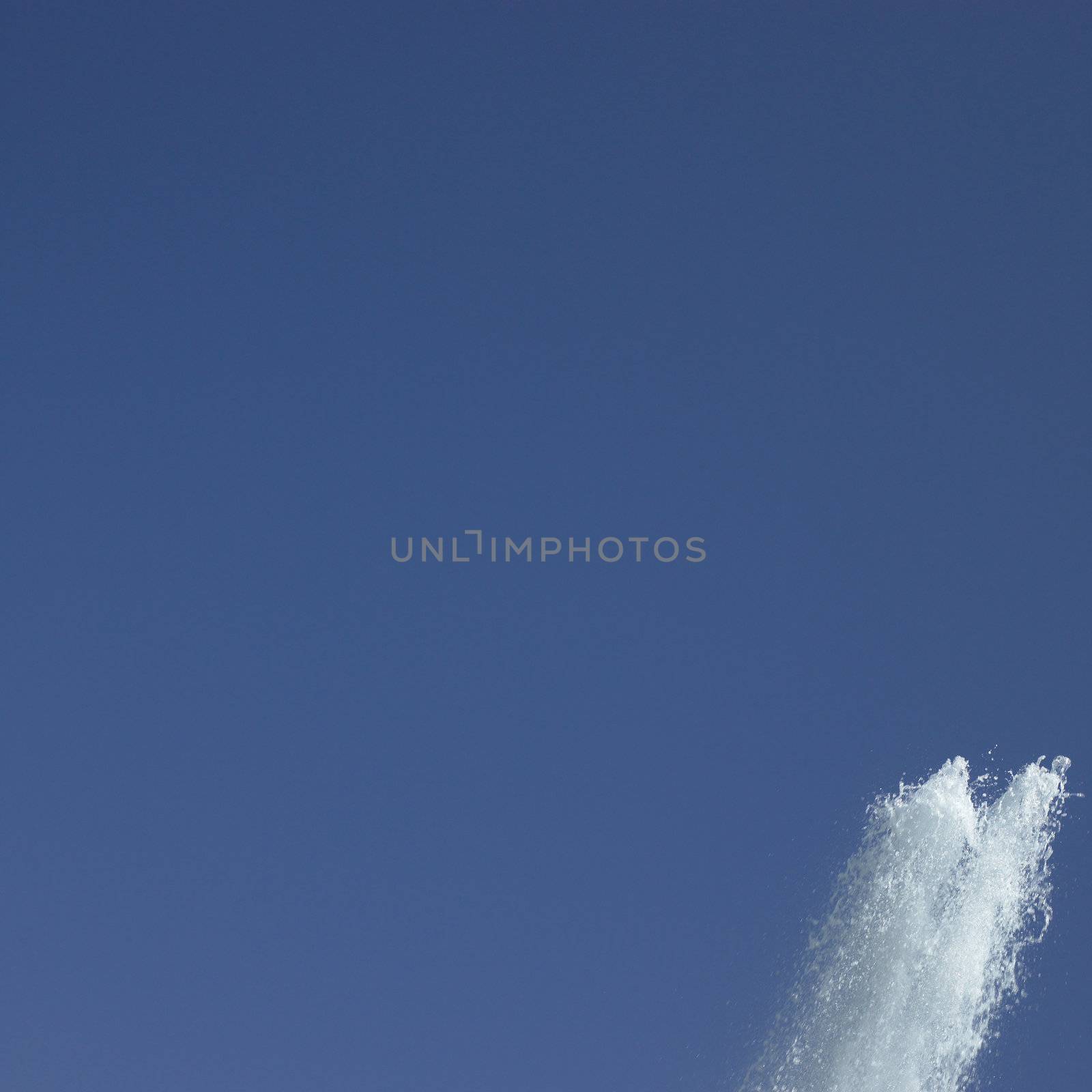 Fountain in the blue sky