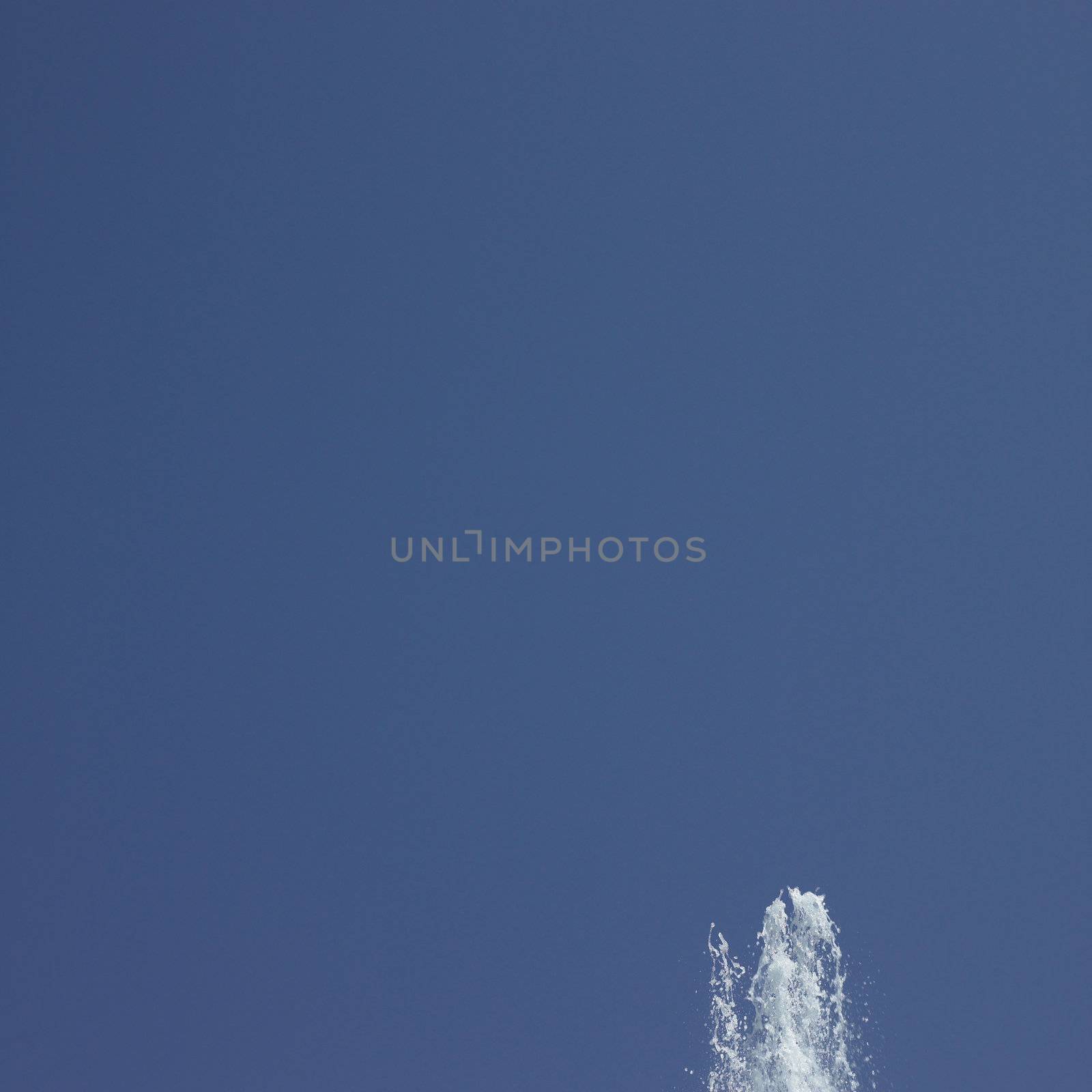 Fountain in the blue sky