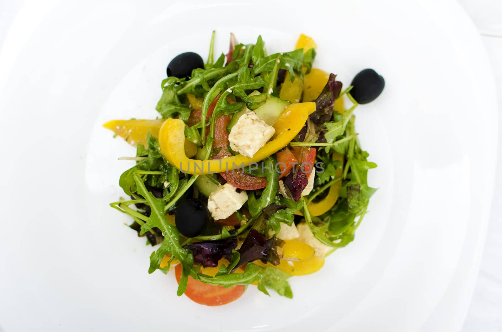 fresh Greek salad on white plate