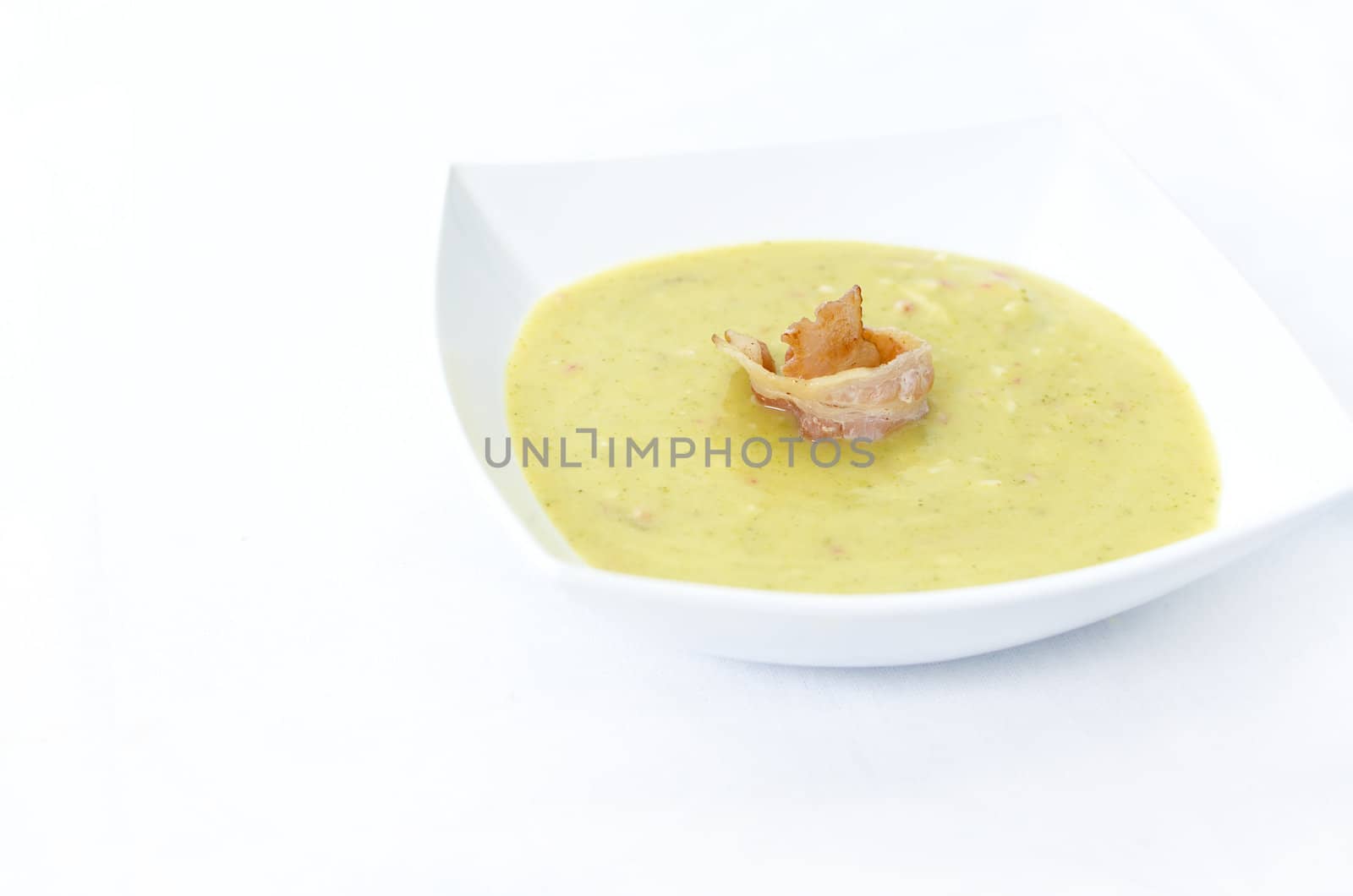 Broccoli cream soup in white plate