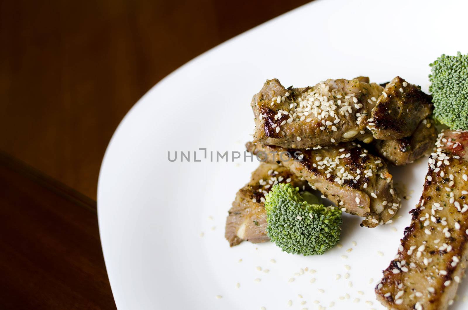 baked pork ribs on a white plate