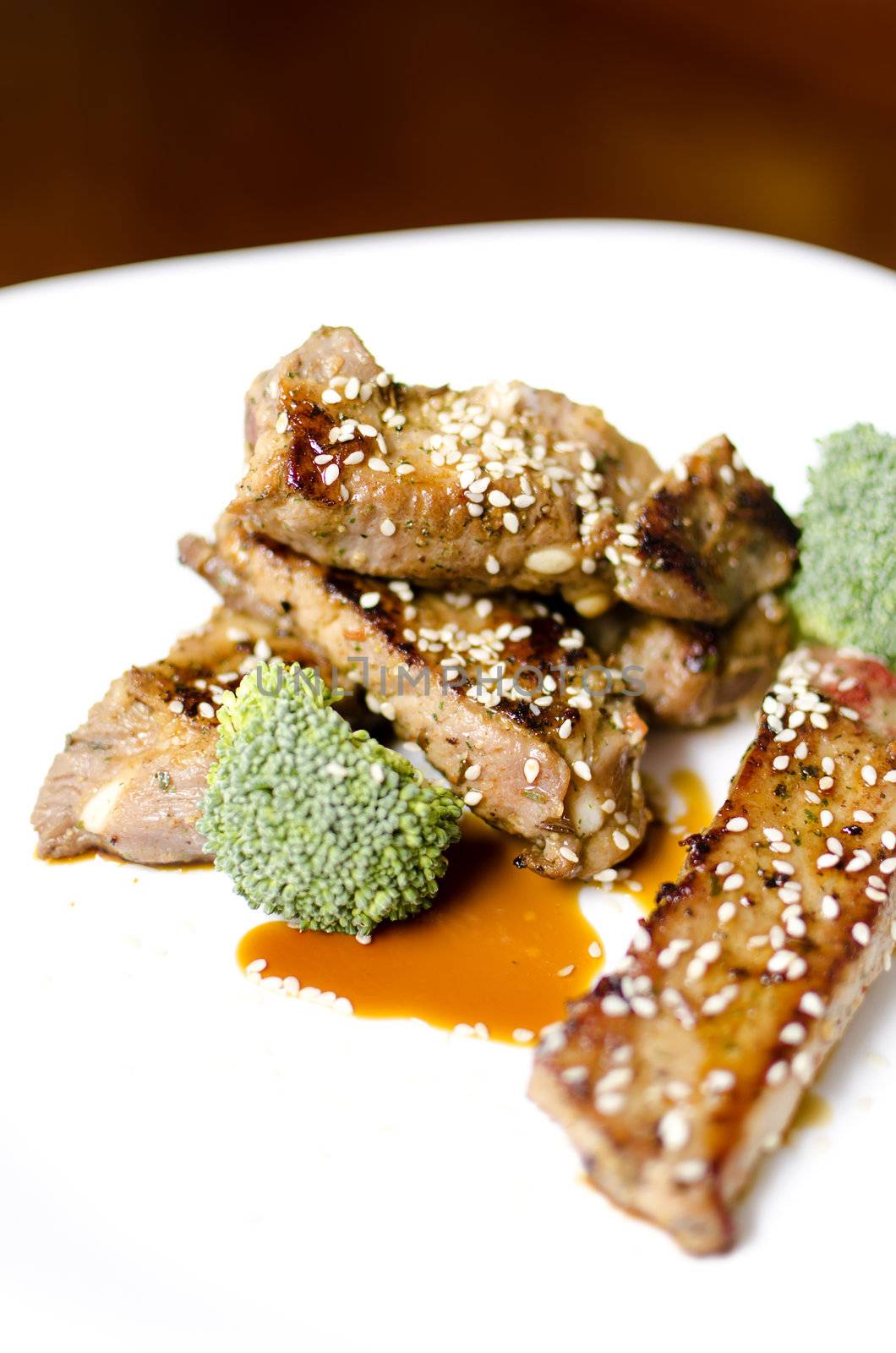 baked pork ribs on a white plate