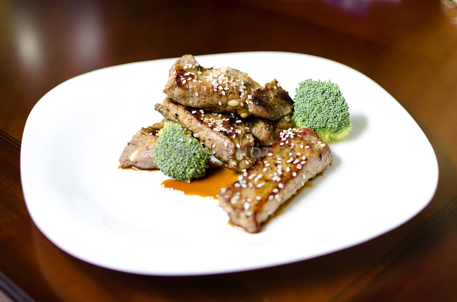baked pork ribs on a white plate