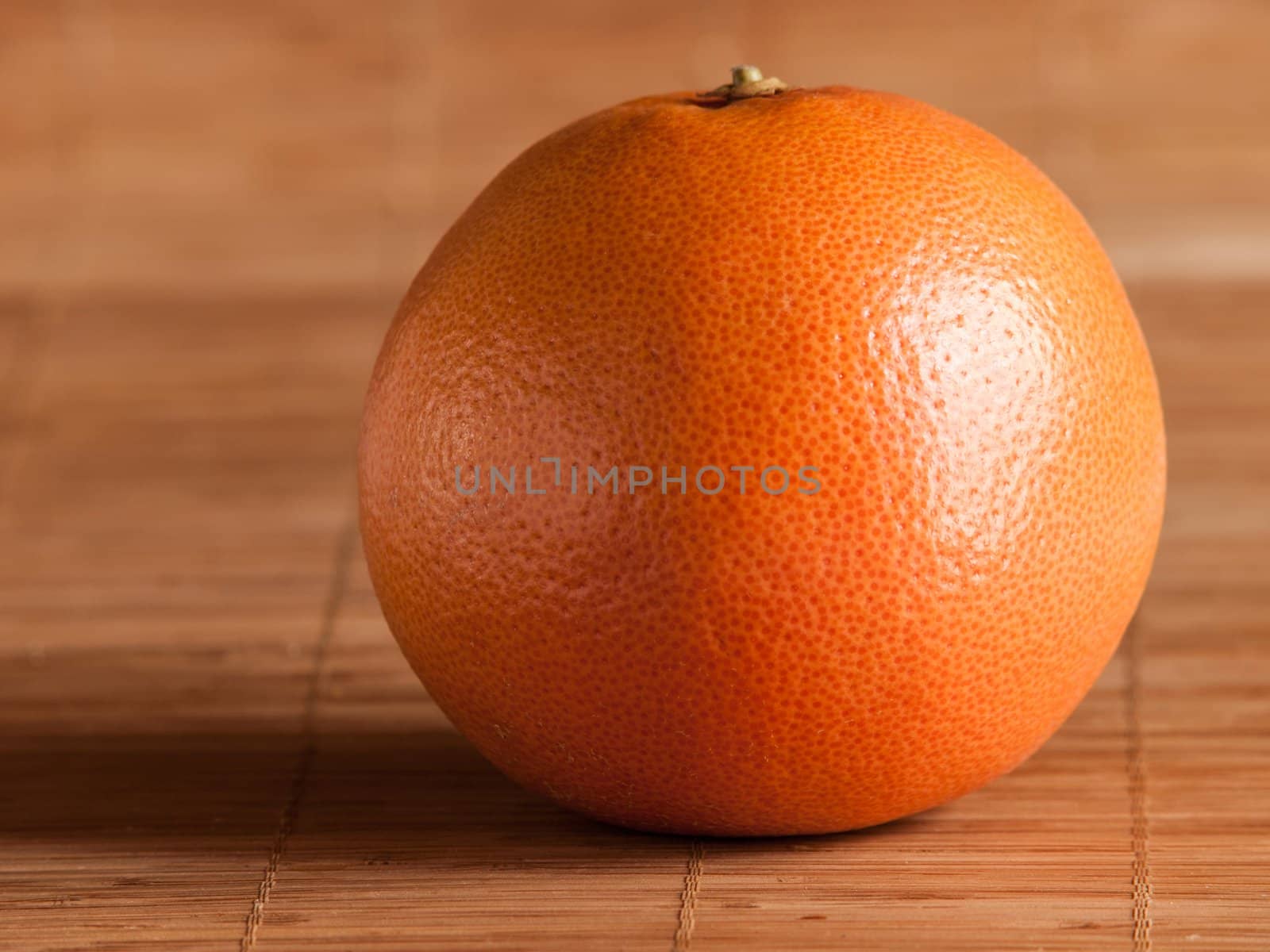 Photo of grapefruit on a straw mat in the kitchen