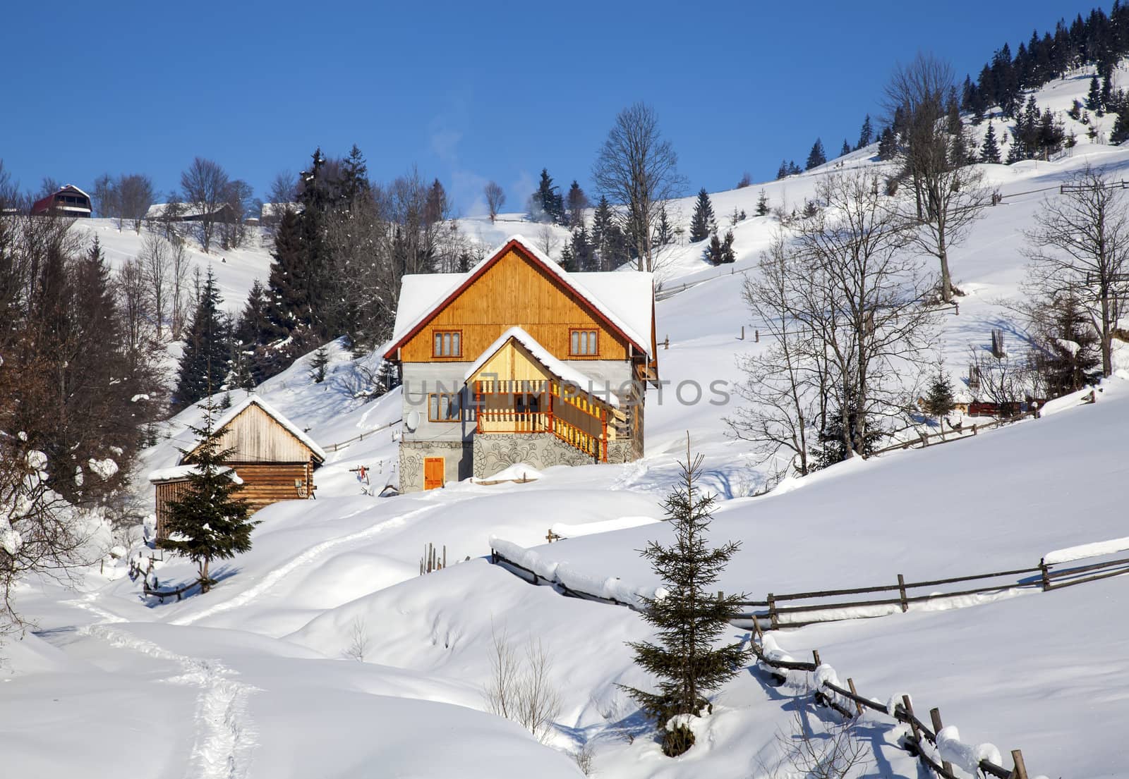 Wooden chalet in winter Carpathian mountains