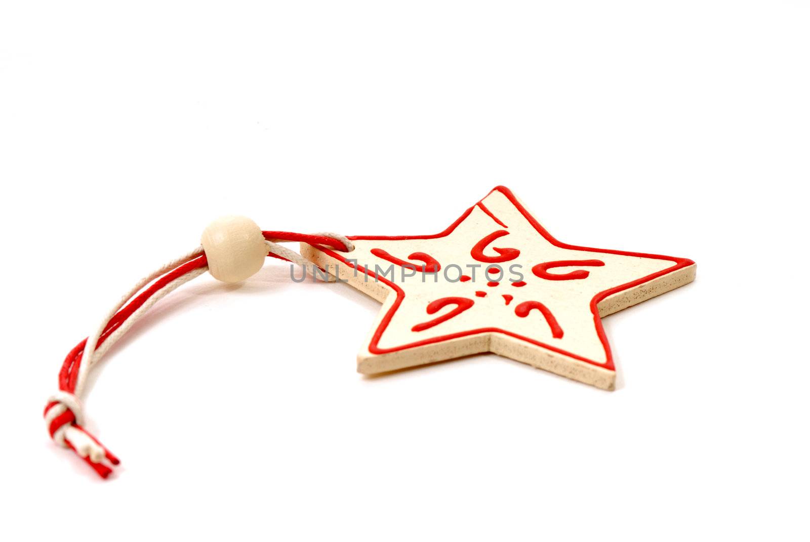 Wood star Christmas ornament on a white background