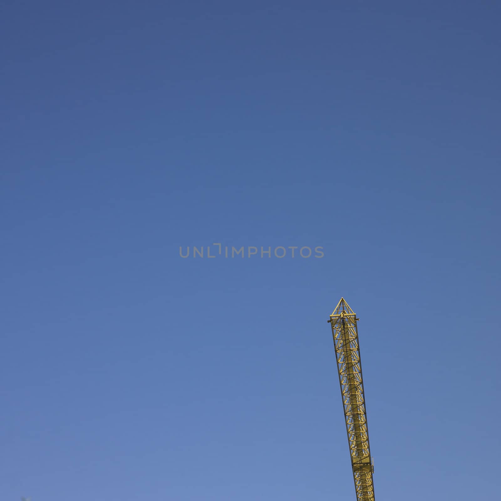 yellow construction crane and blue sky