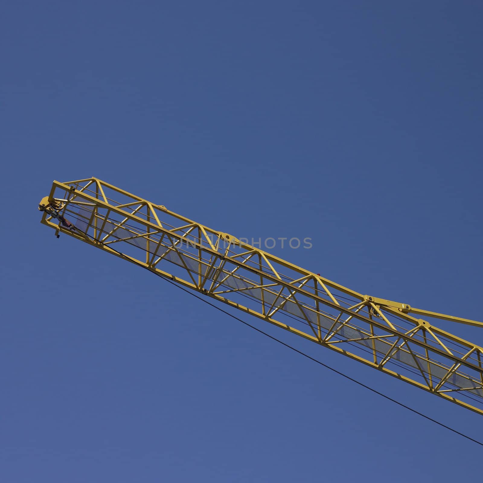 yellow construction crane and blue sky