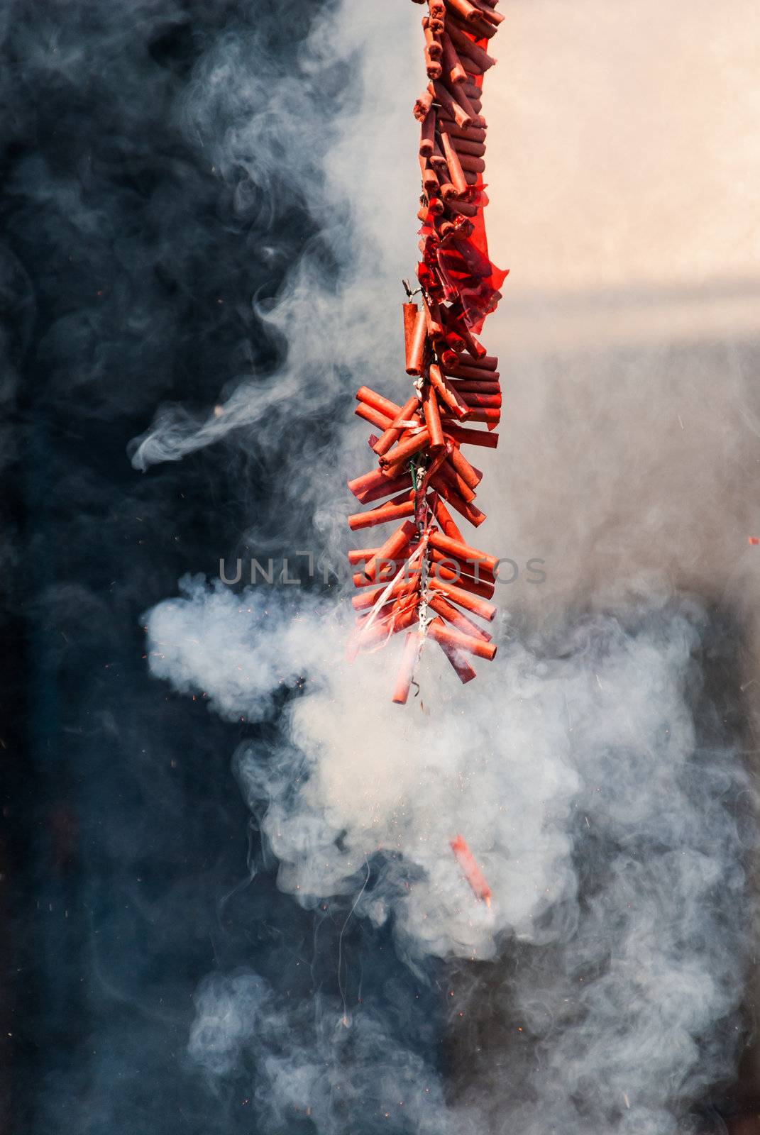 Chinese firecracker is a small explosive device primarily designed to produce a large amount of noise, especially in the form of a loud bang. They have fuses, and are wrapped in a heavy paper casing to contain the explosive compound. Firecrackers, along with fireworks, originated in China.