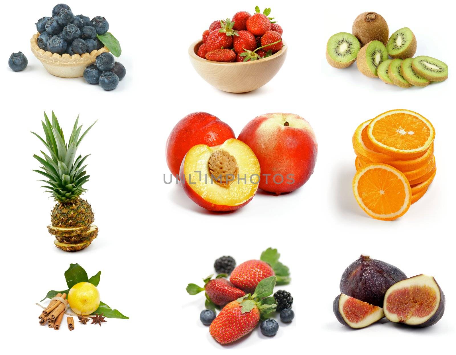 Fruits Collection with Blueberries, Strawberries, Kiwi, Pineapple, Slices of Orange, Nectarines, Lemon, Blackberries and Figs isolated on white background