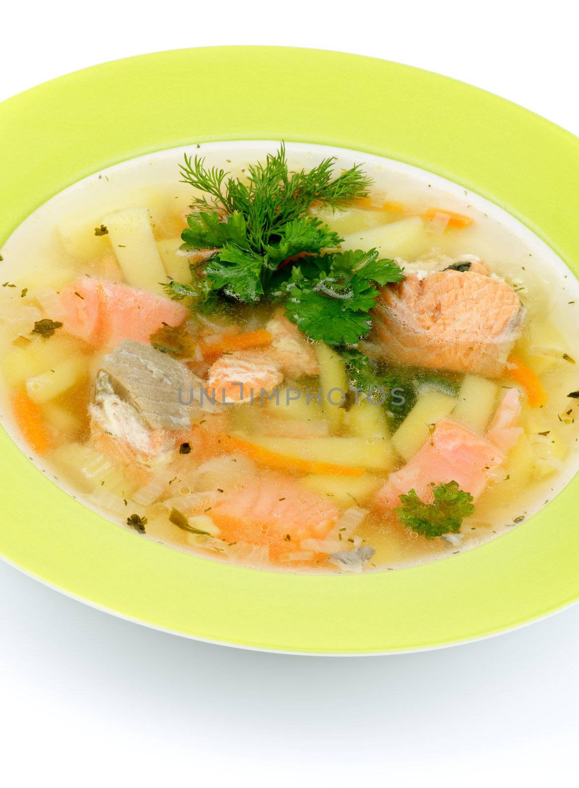 Green Plate of Fish Soup with Salmon, Cod, Trout, Potato, Carrot decorated with Dill and Parsley closeup on white background