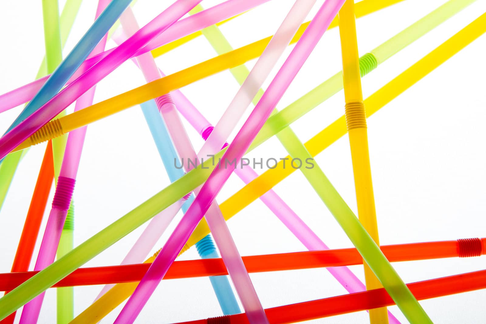 Drinkin straws isolated against a white background while being backlit