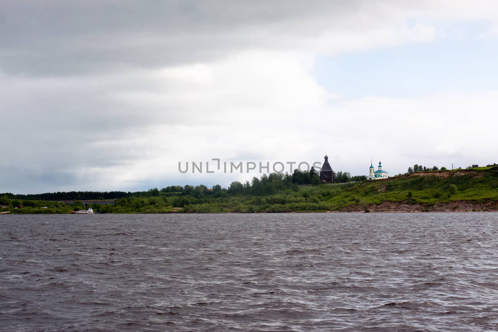 Landscape with big river and churches
